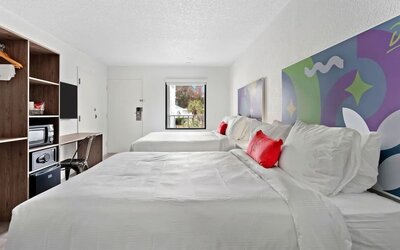 Day room with workspace and natural light at Baymont By Wyndham Jacksonville Airport.
