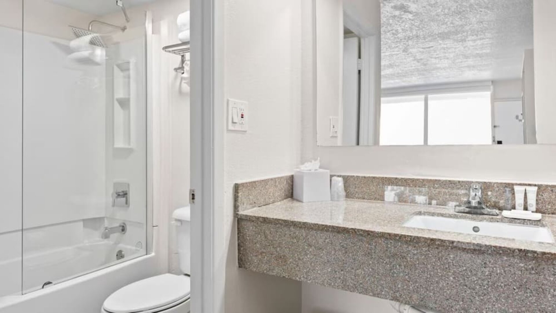 Bathroom with towels at Baymont By Wyndham Jacksonville Airport.