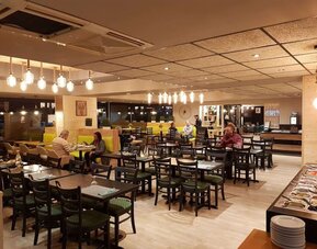 Dining area at EUROHOTEL Airport Orly Rungis.