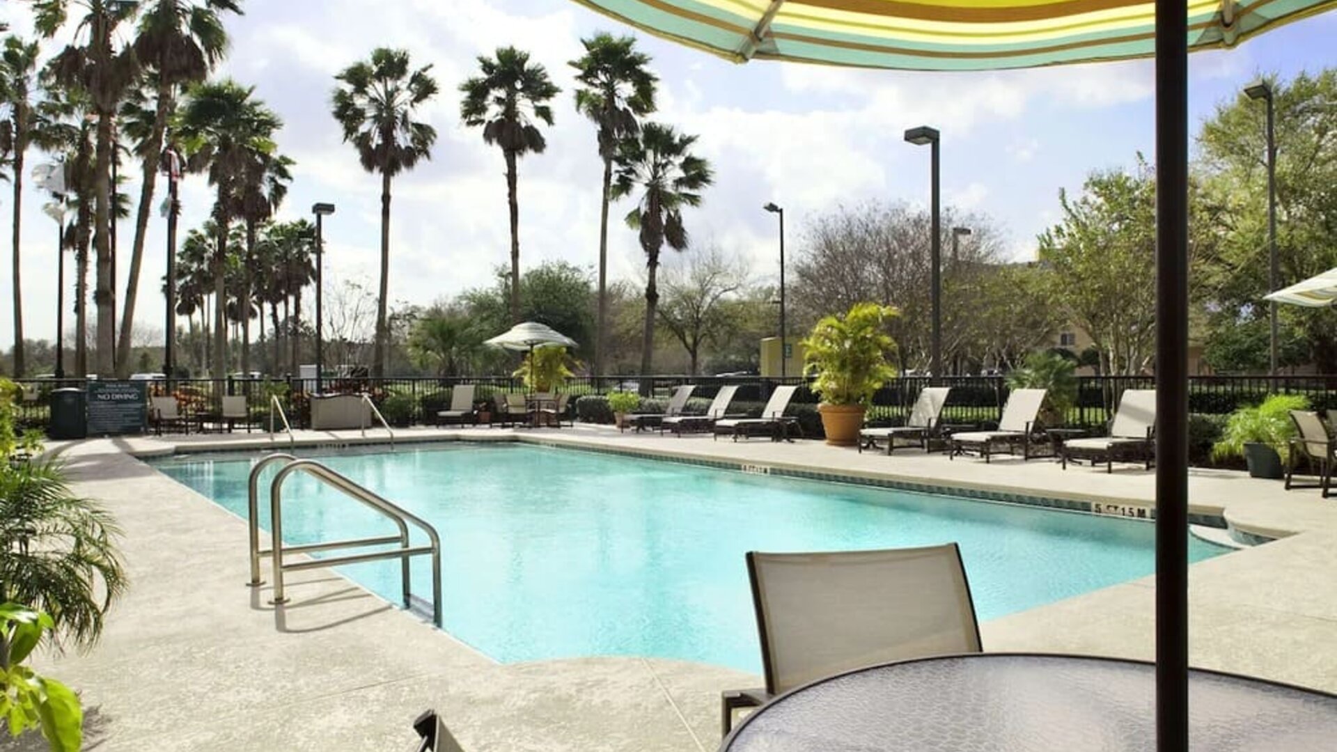Outdoor pool at Embassy Suites By Hilton Orlando Airport.