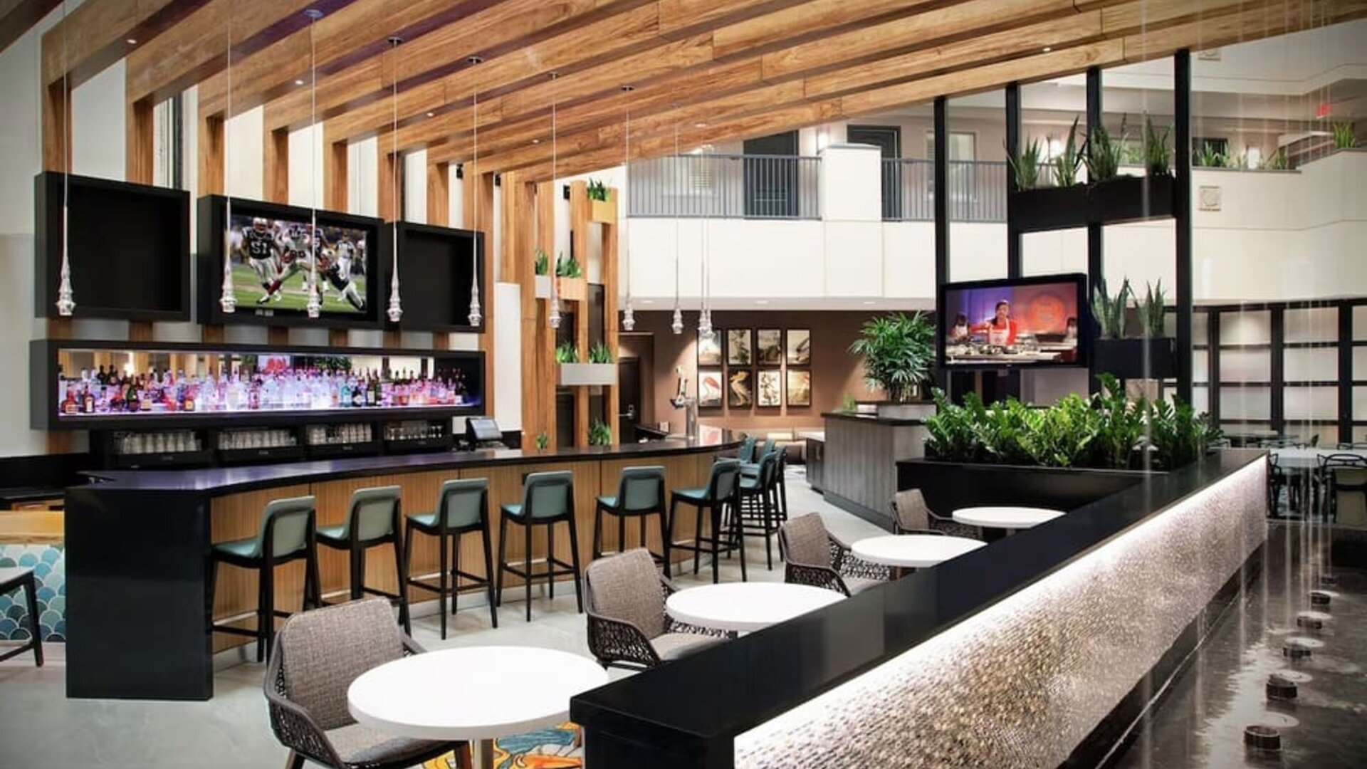Hotel bar and lounge at Embassy Suites By Hilton Orlando Airport.