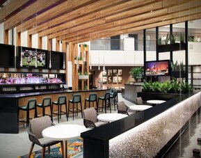 Hotel bar and lounge at Embassy Suites By Hilton Orlando Airport.