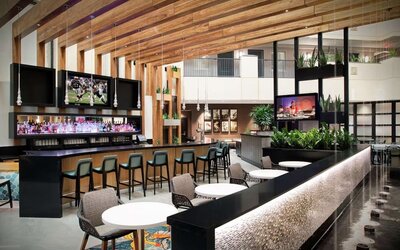 Hotel bar and lounge at Embassy Suites By Hilton Orlando Airport.