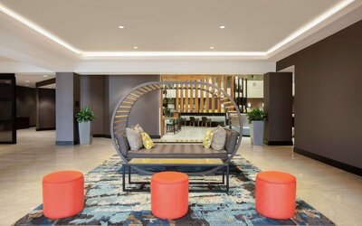 Lobby seating at Embassy Suites By Hilton Orlando Airport.