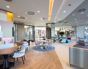 Lobby and lounge at Hampton By Hilton Krakow Airport.