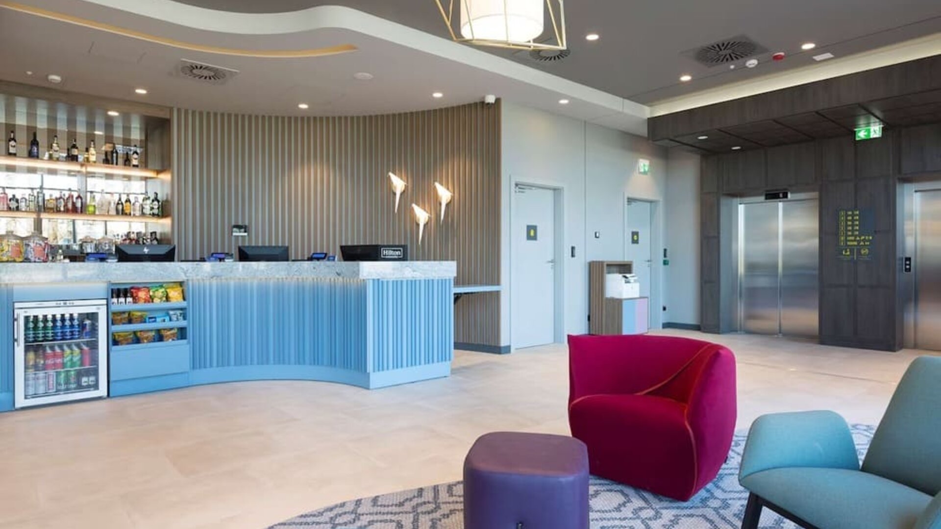 Lobby and lounge at Hampton By Hilton Krakow Airport.