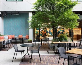 Outdoor dining at Canopy By Hilton Austin Downtown.