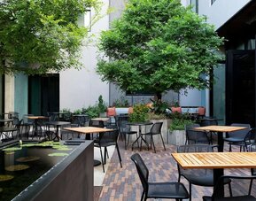 Outdoor dining at Canopy By Hilton Austin Downtown.