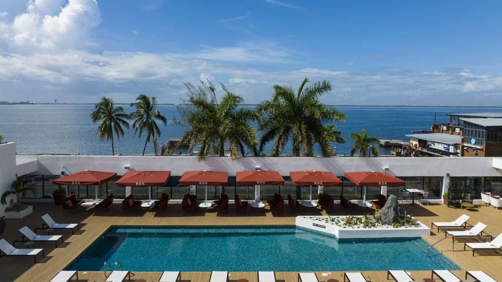 Pool loungers and cabanas at ROK Hotel Kingston, Tapestry Collection By Hilton.