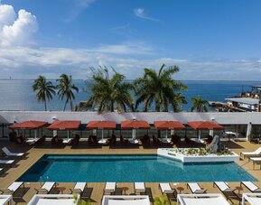 Pool loungers and cabanas at ROK Hotel Kingston, Tapestry Collection By Hilton.
