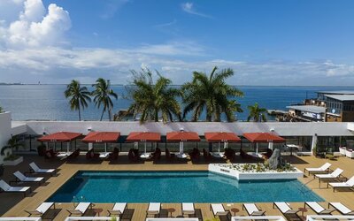 Pool loungers and cabanas at ROK Hotel Kingston, Tapestry Collection By Hilton.