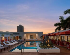 Pool loungers and cabanas at ROK Hotel Kingston, Tapestry Collection By Hilton.