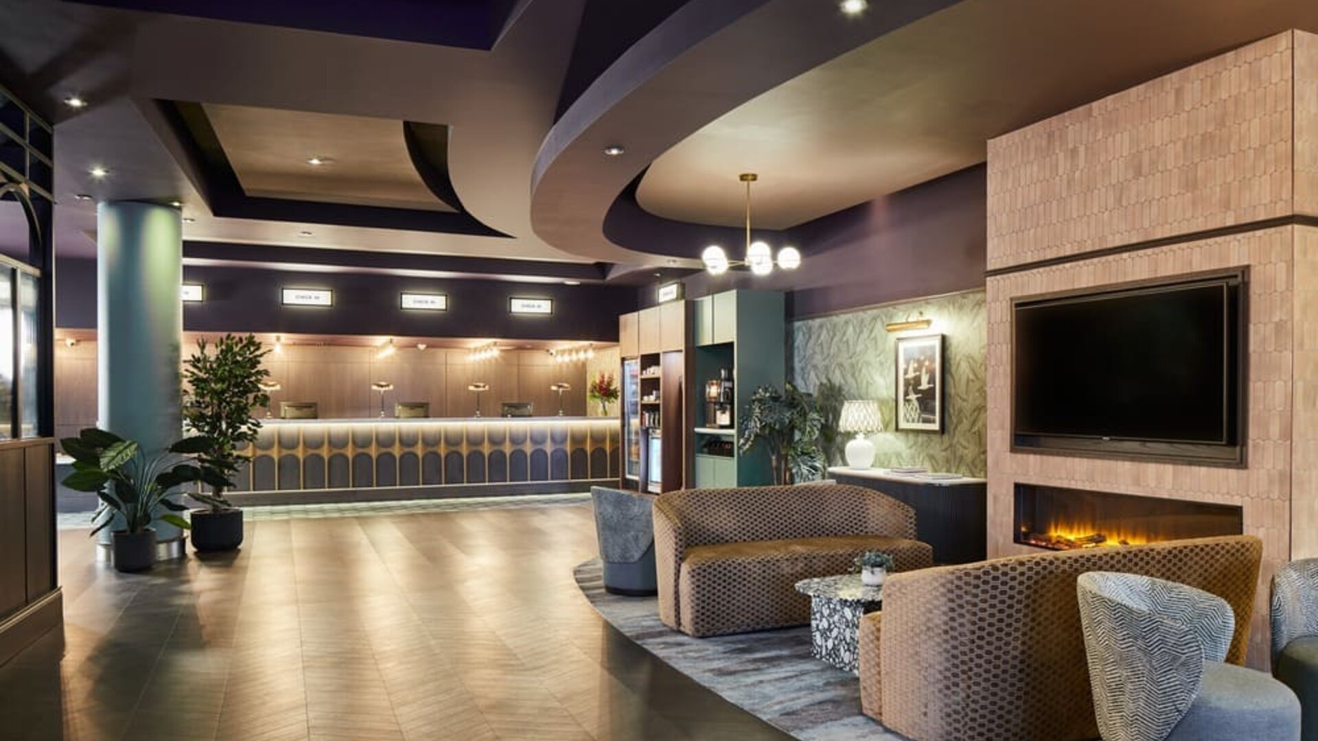 Reception with lobby seating at Leonardo Hotel Dublin Parnell Street.