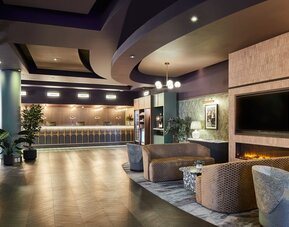 Reception with lobby seating at Leonardo Hotel Dublin Parnell Street.