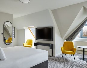 Day room with seating area at Leonardo Hotel Dublin Christchurch.