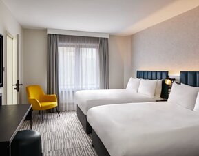 Two queen beds with TV at Leonardo Hotel Dublin Christchurch.