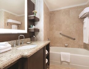 Modern bathroom at Hilton Los Angeles/San Gabriel with modern facilities and plush towels.