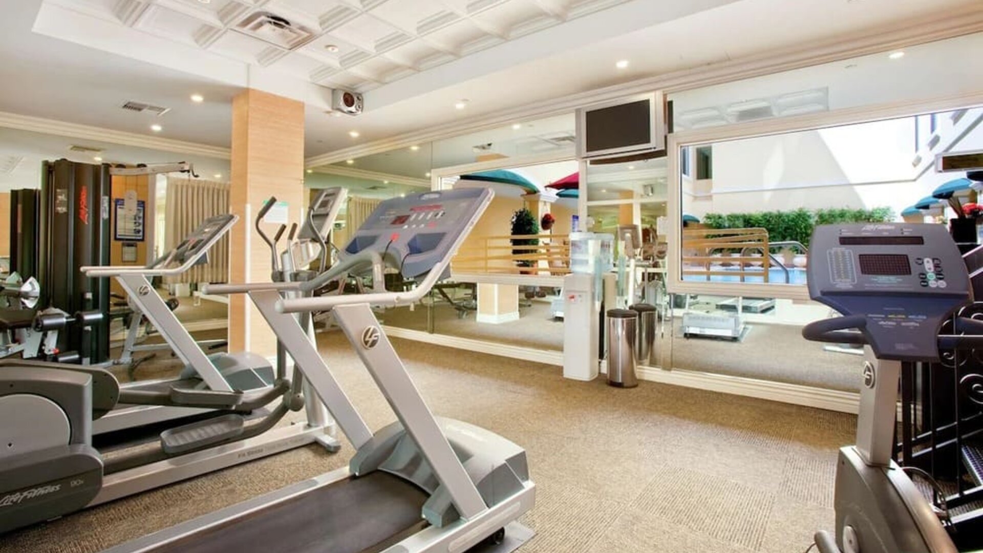 Fitness center at Hilton Los Angeles/San Gabriel with a variety of equipment for a full workout.