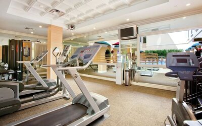 Fitness center at Hilton Los Angeles/San Gabriel with a variety of equipment for a full workout.