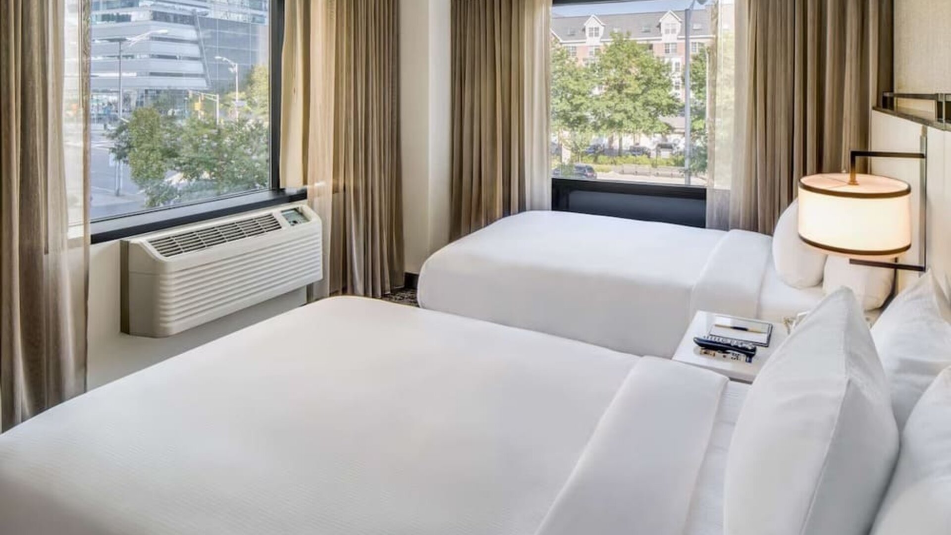 Comfortable day room at DoubleTree By Hilton Jersey City with natural light and beautiful views.