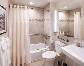 Fully equipped bathroom with plus towels at DoubleTree By Hilton Jersey City.