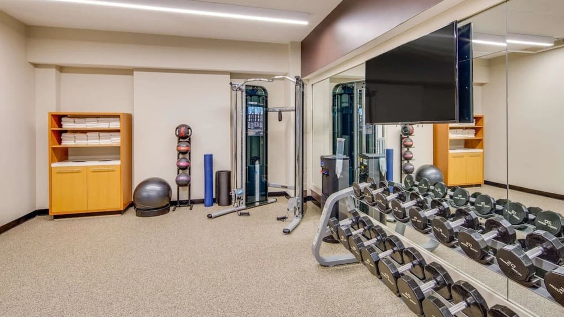Fully equipped fitness center at DoubleTree by Hilton Hotel & Suites Jersey City.
