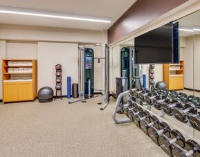 Fully equipped fitness center at DoubleTree by Hilton Hotel & Suites Jersey City.