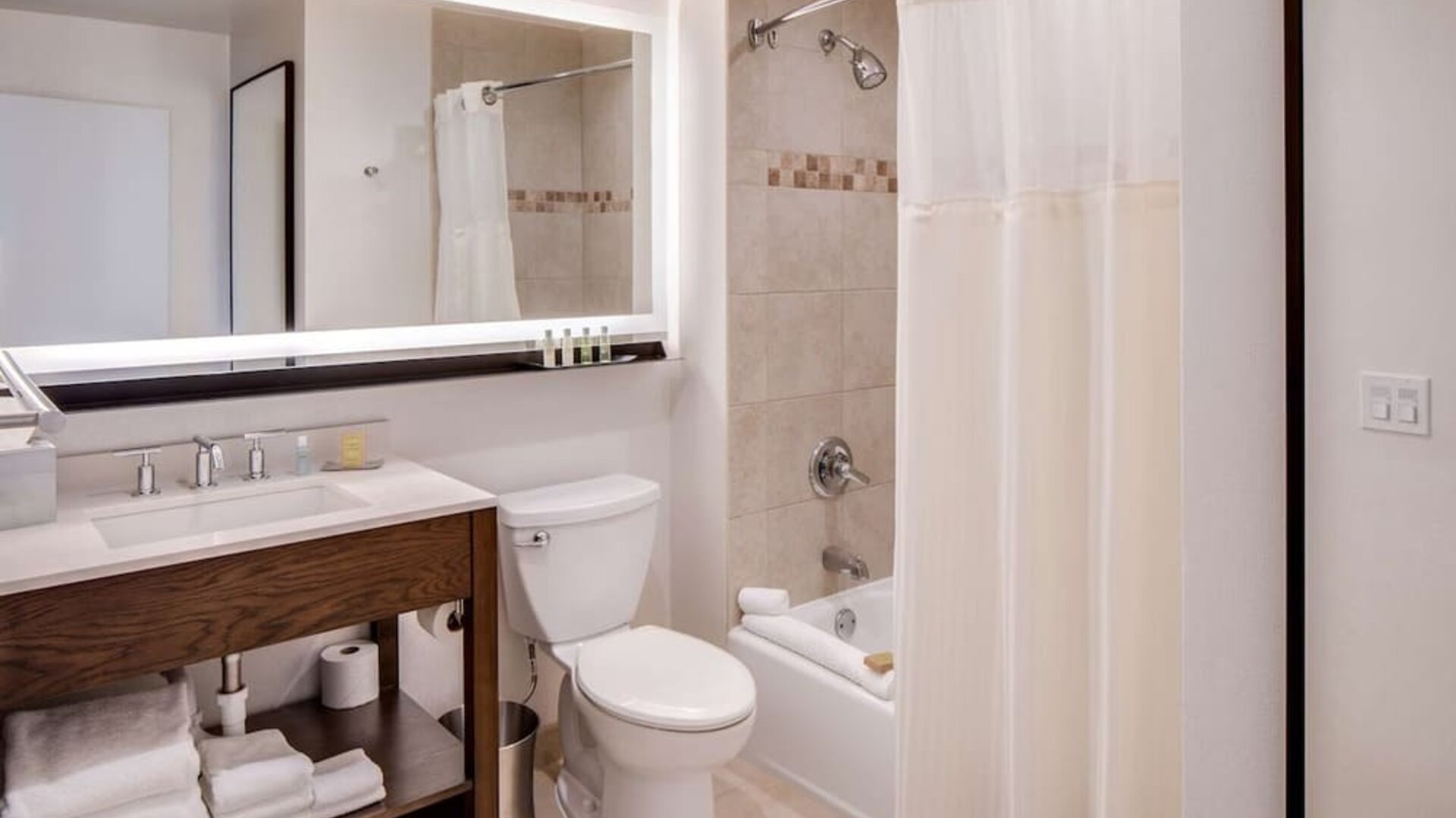 Fully equipped bathroom with plus towels at DoubleTree By Hilton Jersey City.