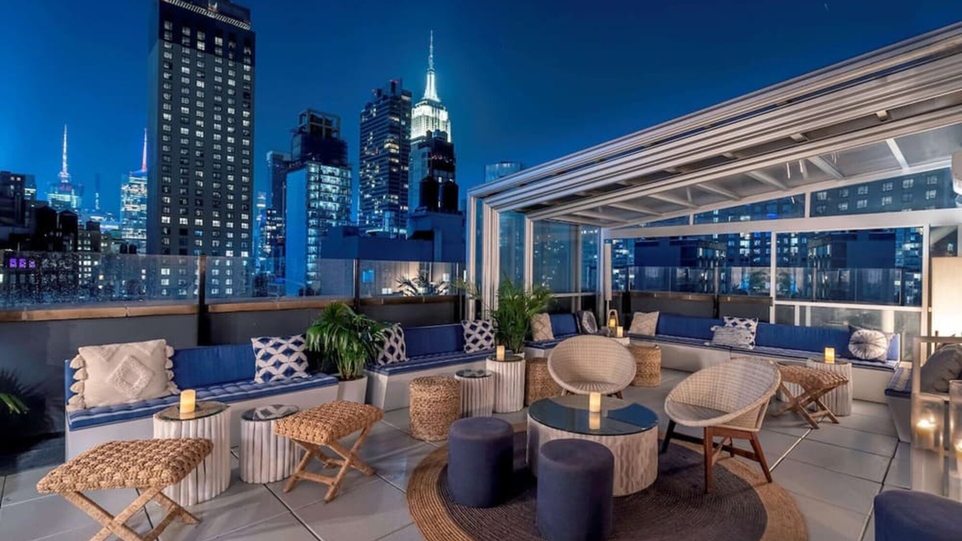 Rooftop bar with seating and beautiful city views at Hilton Fashion District.