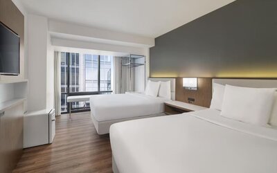 Comfortable day room with natural light at Best Western Premier Empire State Hotel.