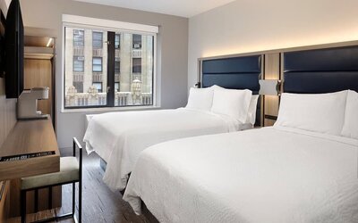 Day use room with a desk, chair, natural light and a beautiful view at Holiday Inn Express New York City - Chelsea.