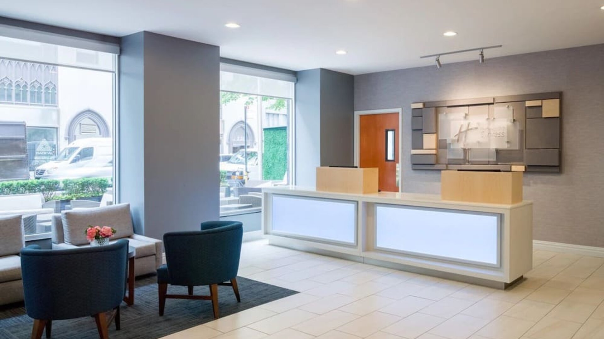 Reception at Holiday Inn Express New York City - Chelsea with comfortable seating.