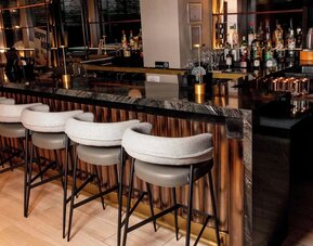 Bar at The Draper Tapestry Collection By Hilton perfect for socializing.