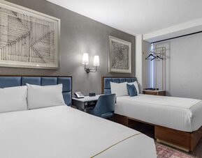 Guest room at The Draper Tapestry Collection By Hilton with workspace desk and chair.