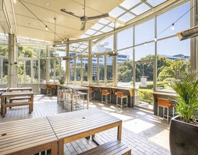 Dining area with natural light perfect for coworking at Crowne Plaza Sydney Airport.