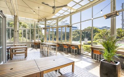 Dining area with natural light perfect for coworking at Crowne Plaza Sydney Airport.