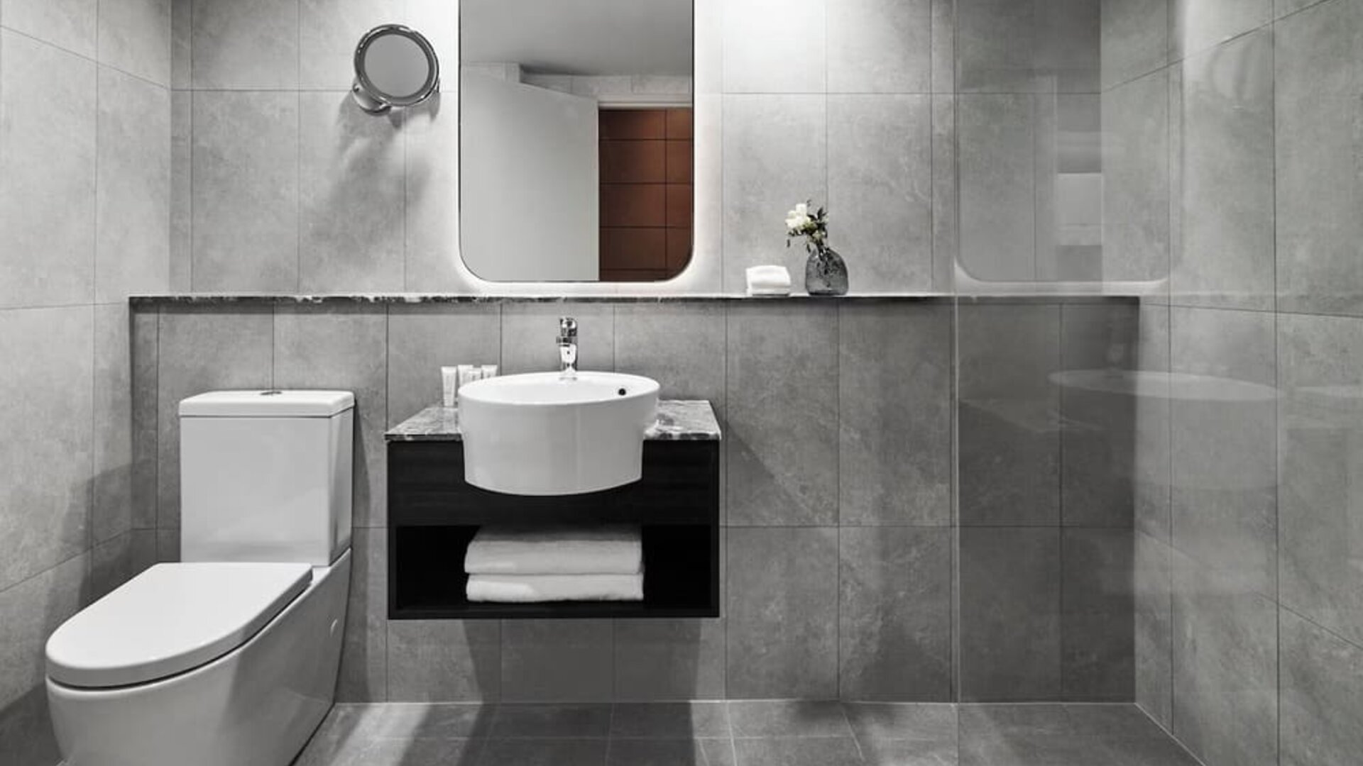 Guest bathroom with shower at Crowne Plaza Sydney Airport.