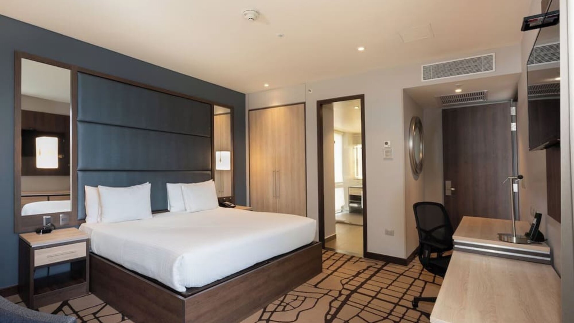 Day use room with work desk at Hilton Garden Inn Bogota Airport.