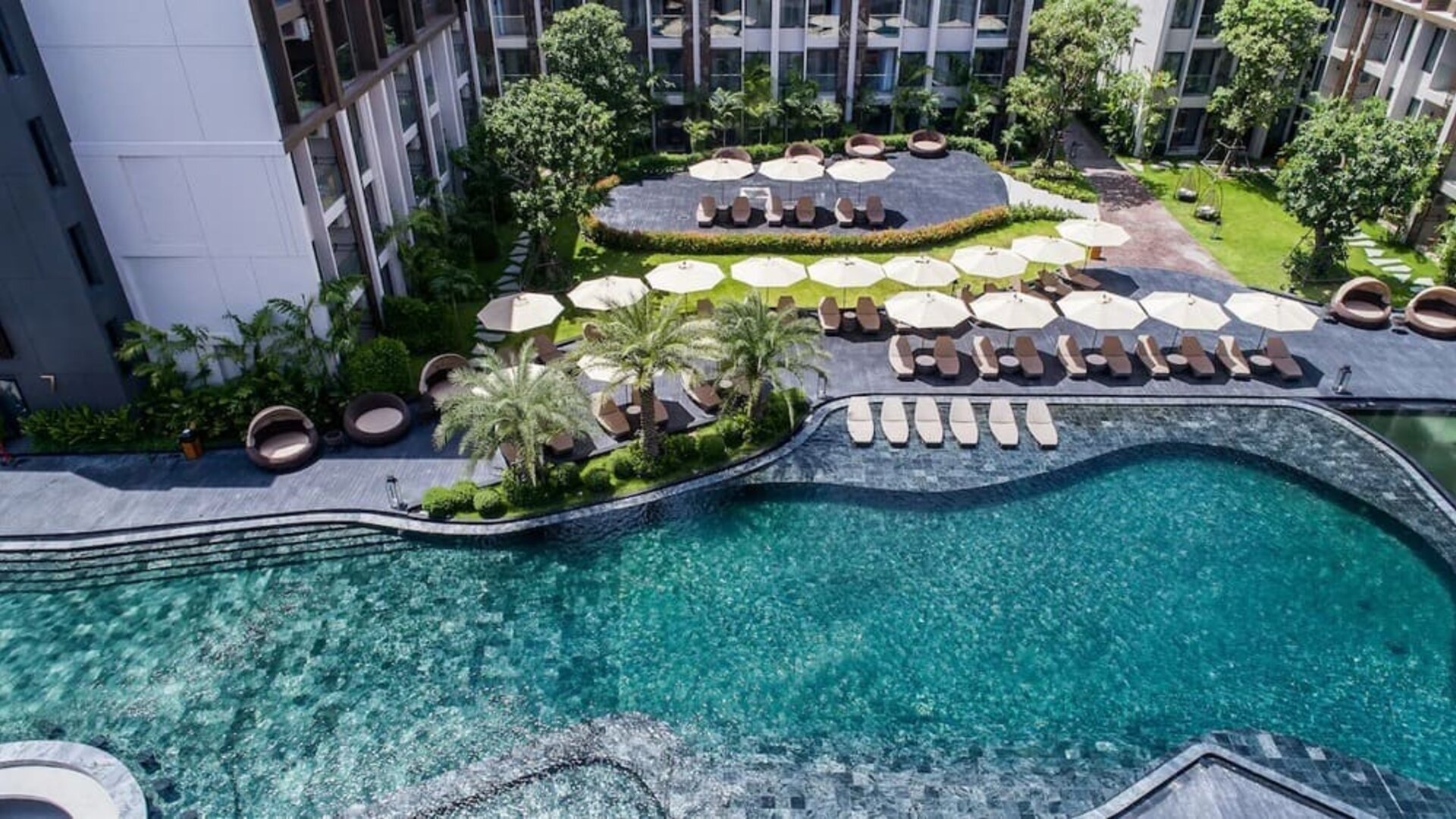 Large outdoor pool at Divalux Resort & Spa Bangkok Suvarnabhumi Airport.