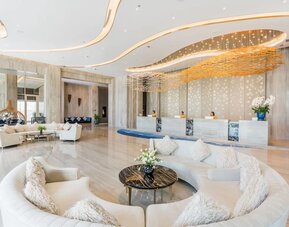 Lobby with comfortable seating at Divalux Resort & Spa Bangkok Suvarnabhumi Airport.