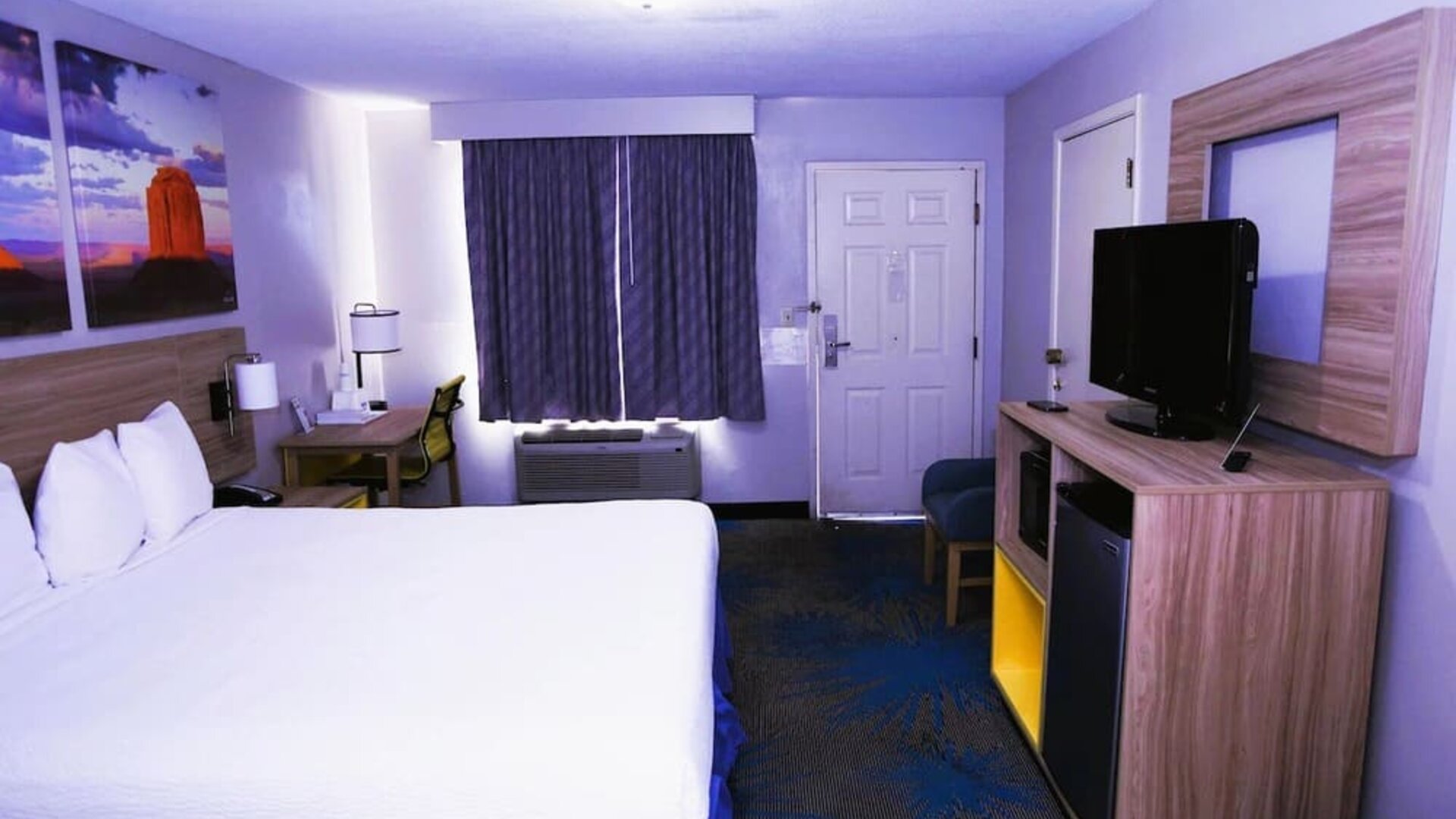 Day room with work desk at Days Inn By Wyndham East Albuquerque.