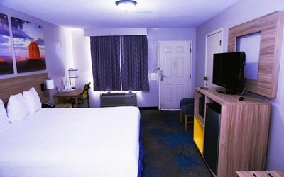 Day room with work desk at Days Inn By Wyndham East Albuquerque.