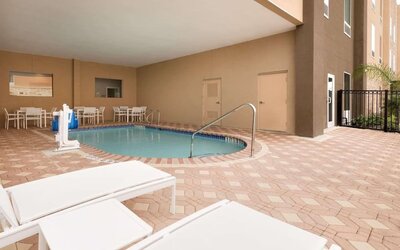Outdoor pool at Country Inn & Suites By Radisson, Katy - Houston West.