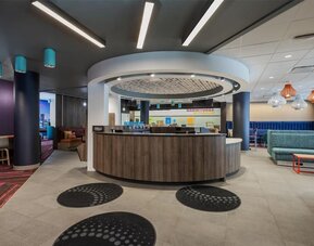 Hotel reception desk at Tru By Hilton Montreal Centre-Ville.