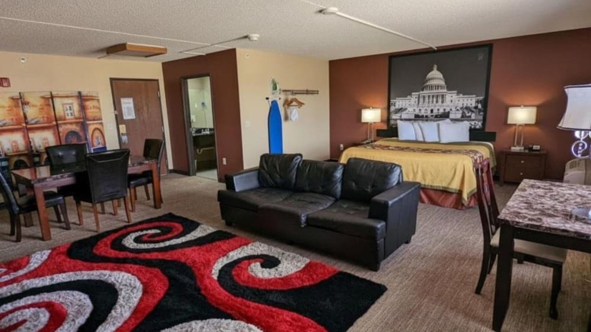 Day room with a couch and workspace at Coratel Inn And Suites By Jasper Wichita North