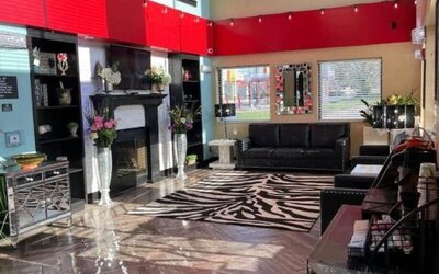 Lobby with comfortable seating at Coratel Inn And Suites By Jasper Wichita North.