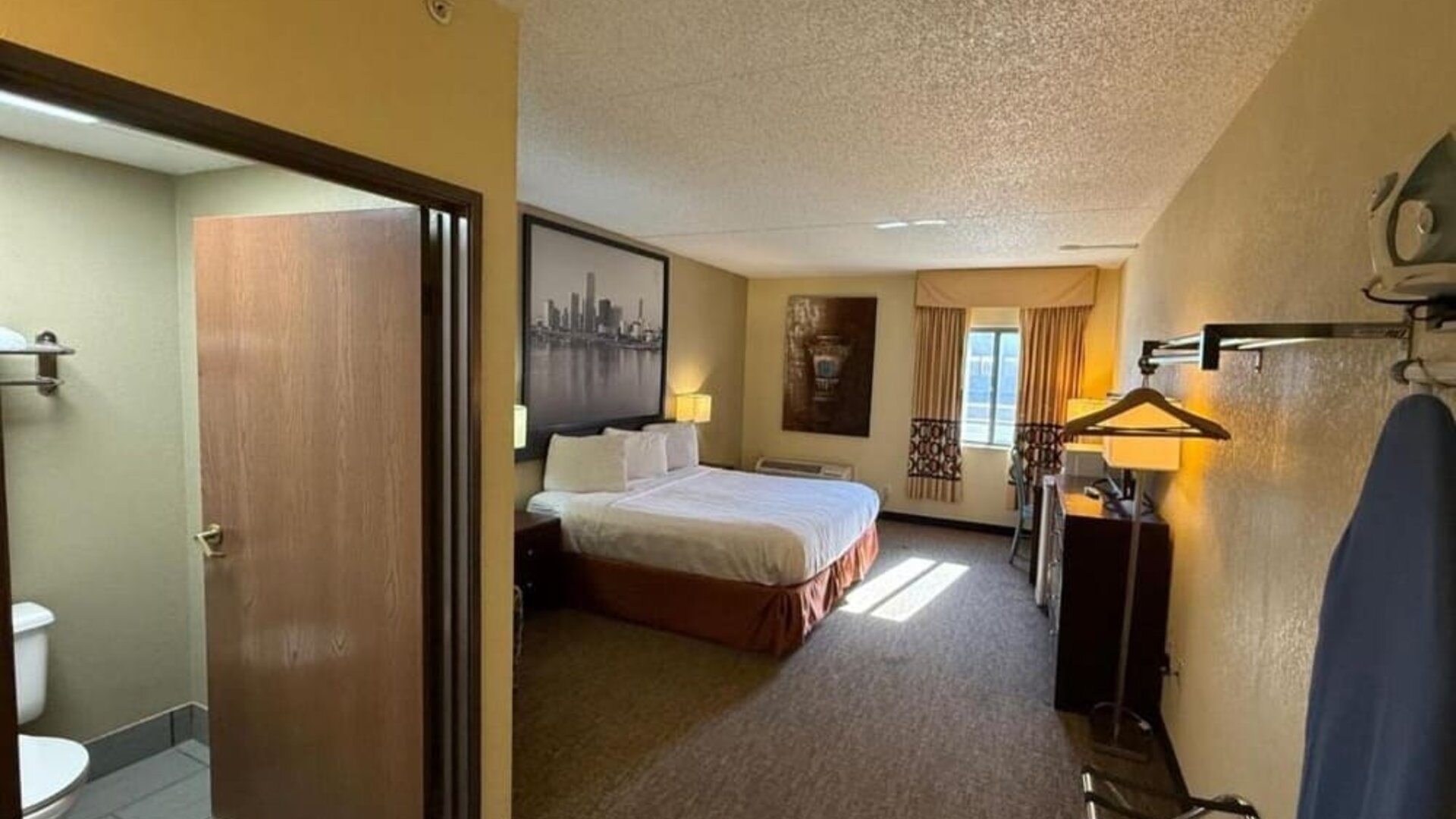 Day room with a desk and chair at Coratel Inn And Suites By Jasper Wichita North