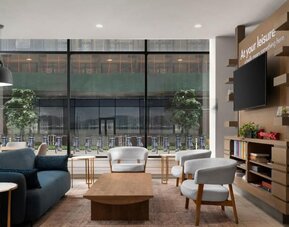 Inviting lobby featuring comfortable seating at EVEN Hotel Brooklyn By IHG.