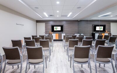 Spacious meeting room perfect for presentations and training at EVEN Hotel Brooklyn By IHG