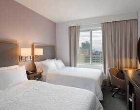 Day use room with work desk and chair at the Hampton Inn Times Square South. 